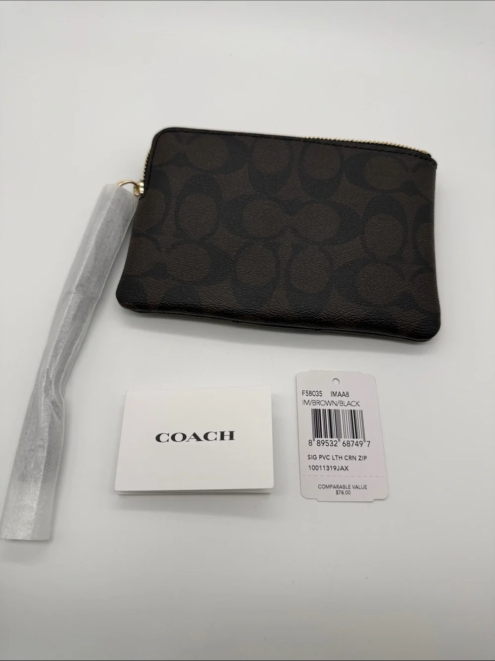 Coach Brown and Black Signature Zip Card Holder 45.00